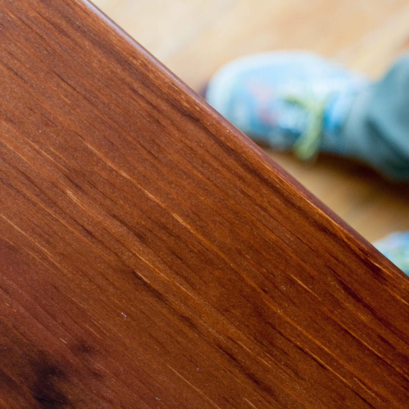 Helen table in antique cherry, closeup tabletop finish detail