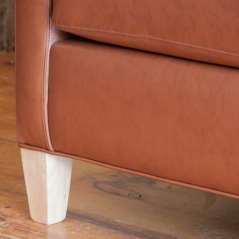 The Holden leather sofa in whisky, leg detail